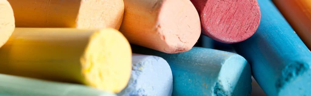 Guide to starting your own graphic design business image - stack of assorted blackboard chalk