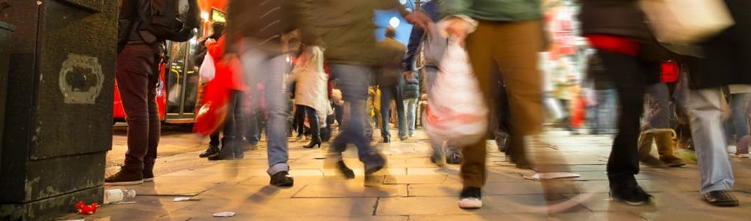 Business Success Lessons from Big Brands - image - people walking quickly with shopping bags