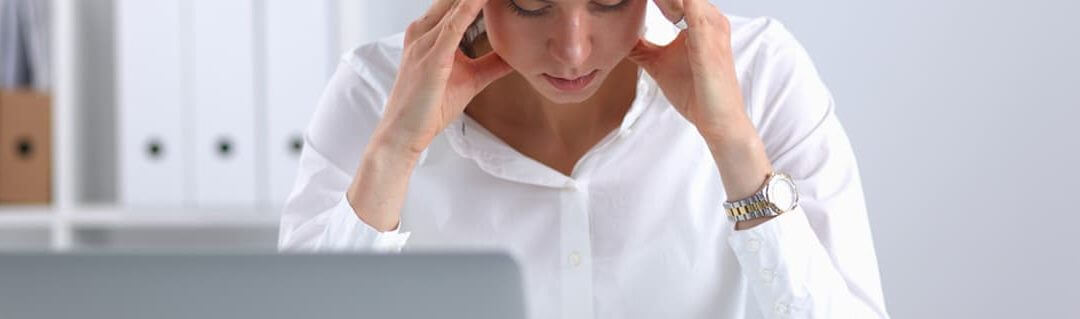 Common Misconceptions when Setting up a Business - image - woman holding head in hands