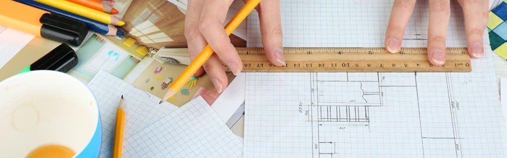 Designers, Toys and Greeting Cards- Entrepreneurial Artists - image - hands drawing house layout on square paper with pencil and ruler
