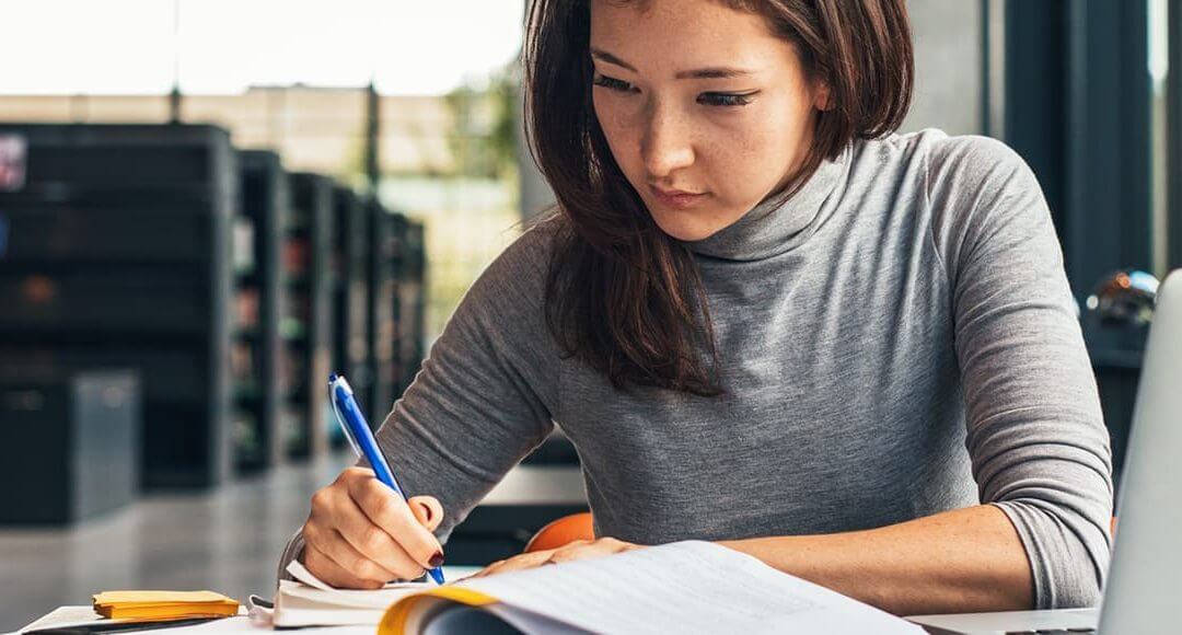 Entrepreneur Award 2017: Winner Announcement image - woman in grey writing in a notebook