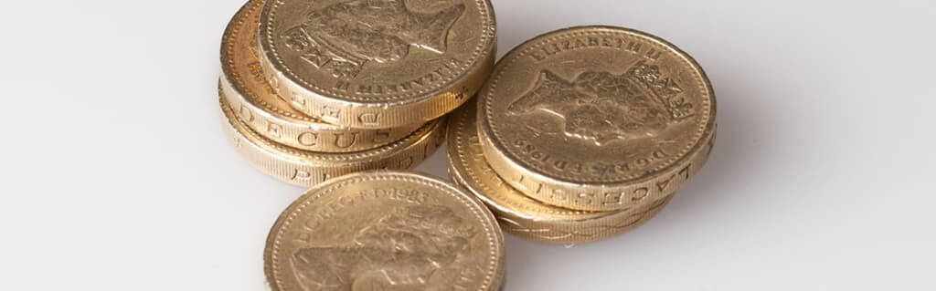 Guide to Managing Cash Flow - image - stacks of pound coins