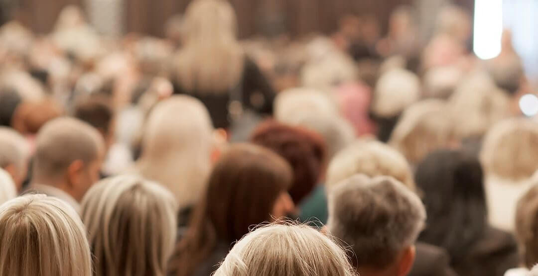 A large group of entrepreneurs networking at an event