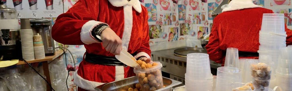 Kitchen employees wearing Christmas outfits