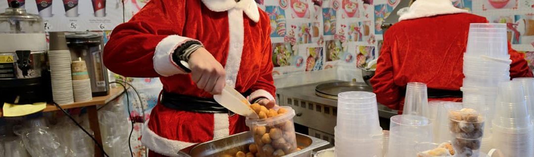 Kitchen employees wearing Christmas outfits