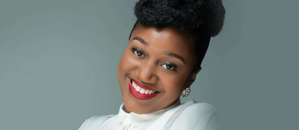 Start-Up Klerissa McDonald - Image - head shot wearing red lipstick and white shirt