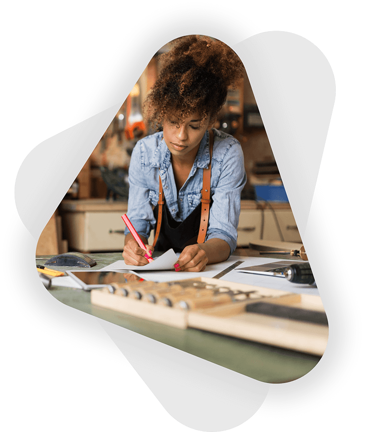 female builder business owner taking notes